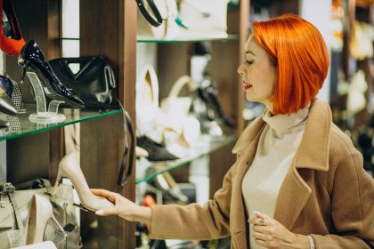 Woman in shopping mall looking for pair of new shoes